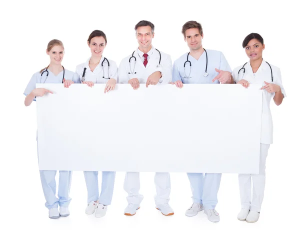 Group Of Doctors With Blank Billboard — Stock Photo, Image