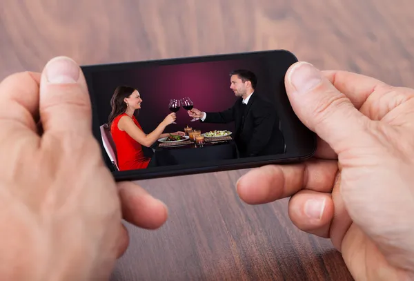 Person Holding Cellphone Watching Video — Stock Photo, Image