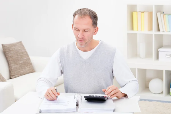 Mature Man Holding Calculator And Bills — Stock Photo, Image