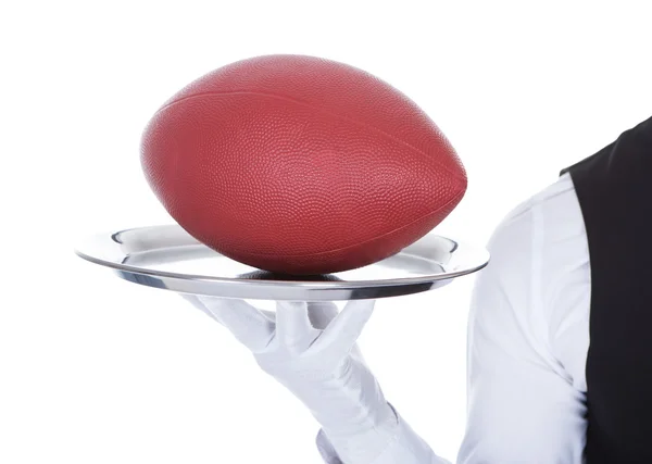 Waiter Carning Rugby Ball — стоковое фото
