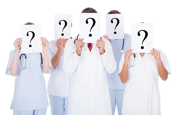 Group Of Doctors With Question Mark Sign — Stock Photo, Image