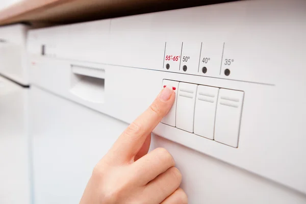 Woman Pressing Button Of Dishwasher — Stock Photo, Image