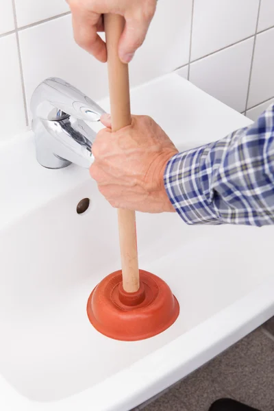 Plumber Pressing Plunger In Sink — Stock Photo, Image