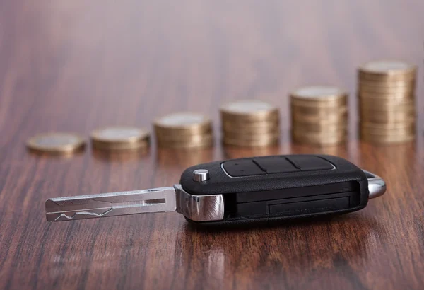 Stack Of Coins With Car Key — Stock Photo, Image