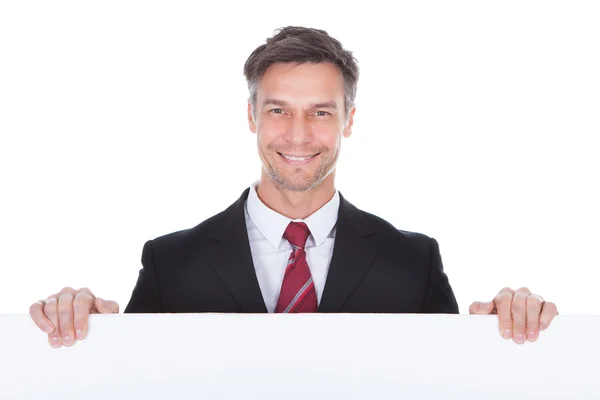 Businessman Presenting Placard — Stock Photo, Image