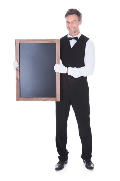 Waiter Holding Chalkboard — Stock Photo, Image
