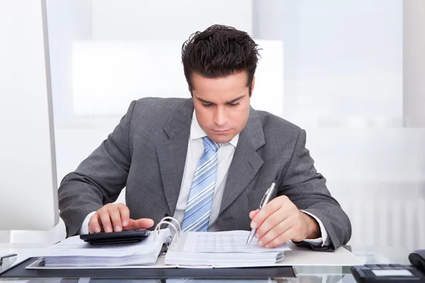 Young Businessman Working At Desk Stock Picture