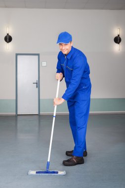 Worker Cleaning Floor