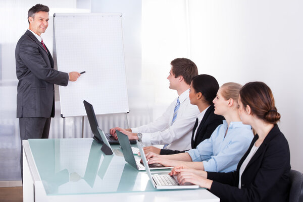 Businessman Giving Presentation To His Colleagues