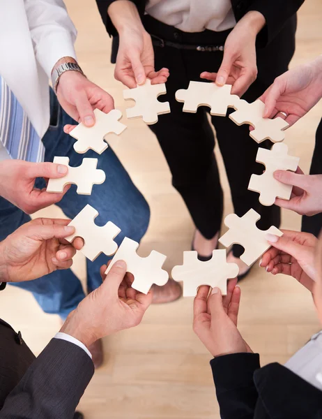 Business People Holding Jigsaw Puzzle — Stock Photo, Image