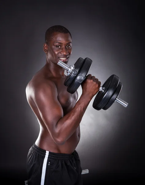 Young African Man Exercising With Dumbbells — Stock Photo, Image