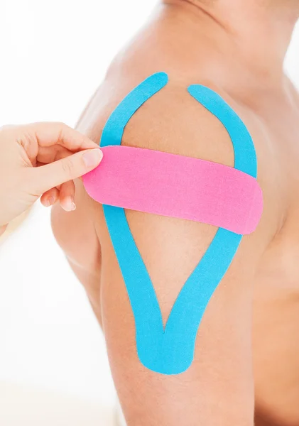 Person Applying Physio Tape To Man — Stock Photo, Image