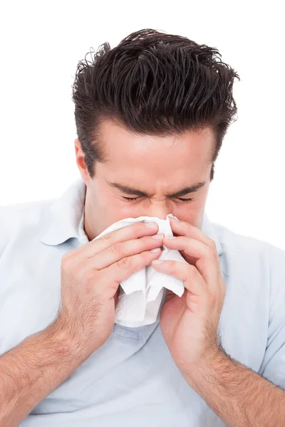 Man Sneezing Into A Tissue — Stock Photo, Image