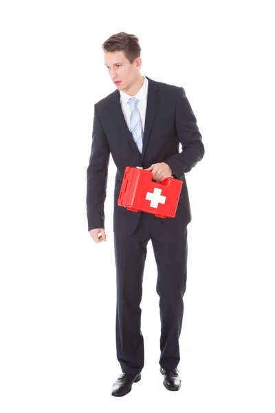 Businessman Holding First Aid Box — Stock Photo, Image