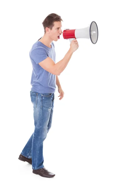 Young Man Shouting Through Megaphone — Stock Photo, Image