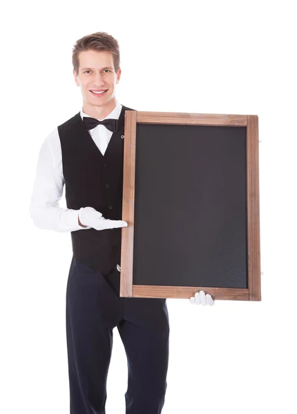 Male Waiter Holding Chalkboard — Stock Photo, Image
