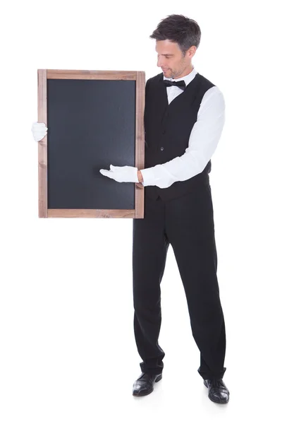 Waiter Holding Chalkboard — Stock Photo, Image