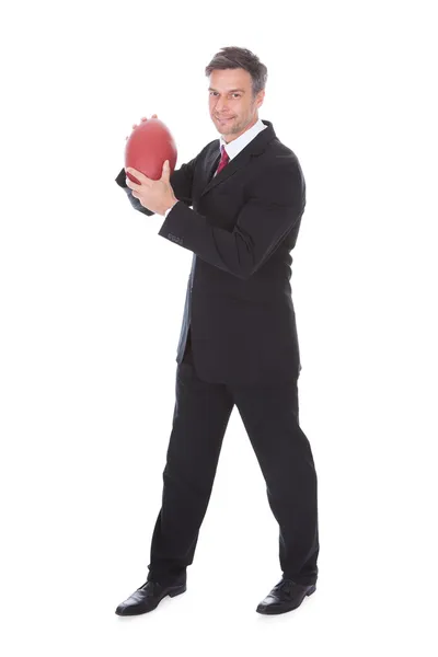 Businessman Holding Rugby Ball — Stock Photo, Image