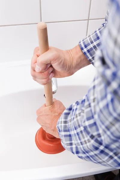 Plumber Pressing Plunger In Sink — Stock Photo, Image