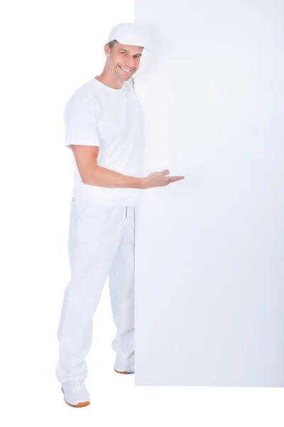 Painter Presenting Blank Placard — Stock Photo, Image