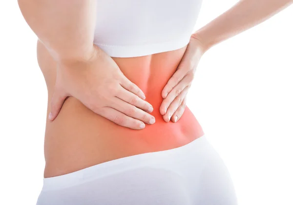 Mujer sufriendo de dolor de espalda — Foto de Stock