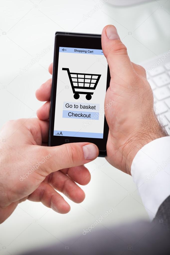 Mobile With Online Shopping Application On A Screen