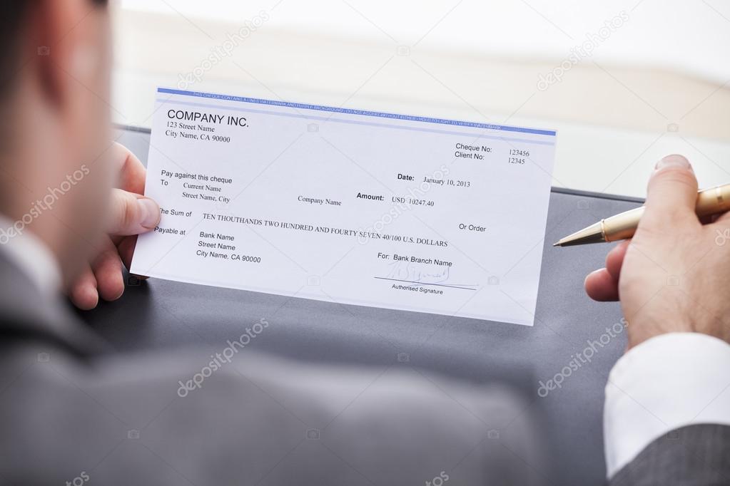 Businessman Filling Cheque