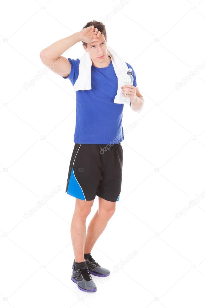 Young Athlete Holding Water Bottle