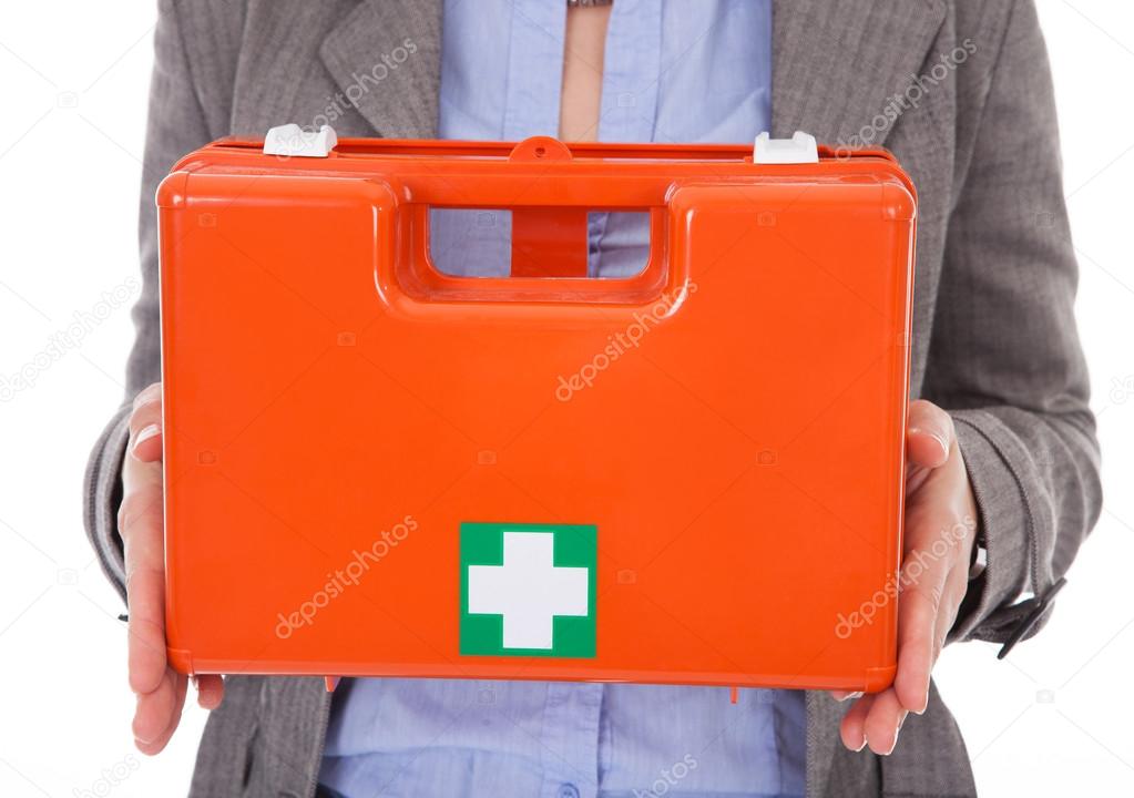 Businesswoman Holding First Aid Box
