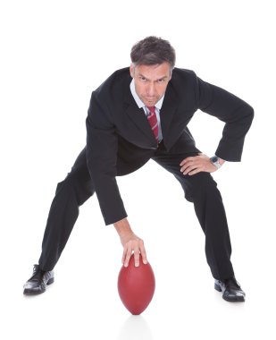 Businessman Playing Rugby clipart