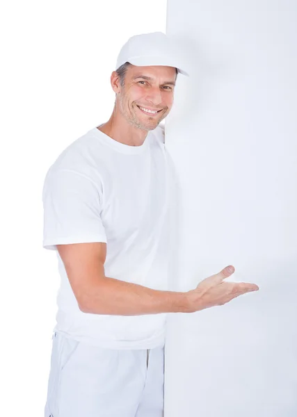 Painter Presenting Blank Placard — Stock Photo, Image