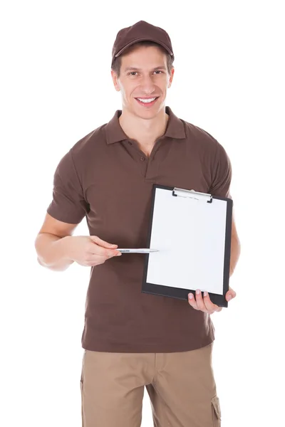 Young Happy Delivery Man Showing Form On Clipboard — Stock Photo, Image