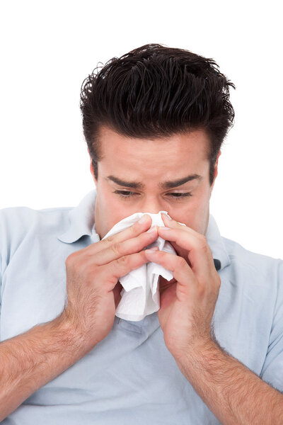 Man Sneezing Into A Tissue