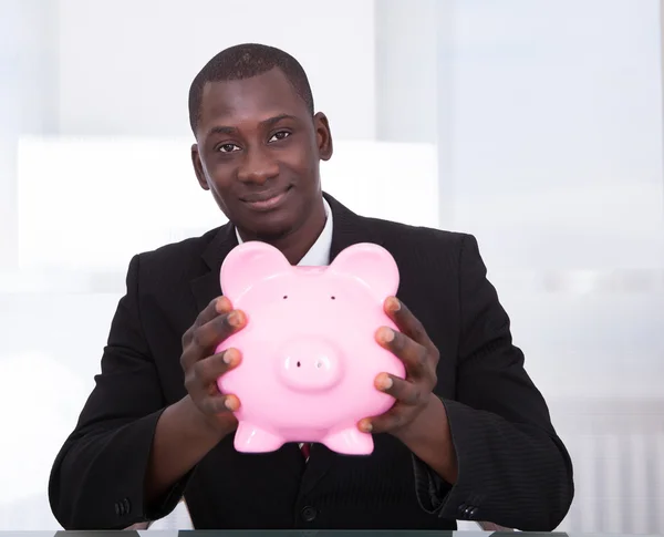 Gazdaság Piggybank üzletember — Stock Fotó