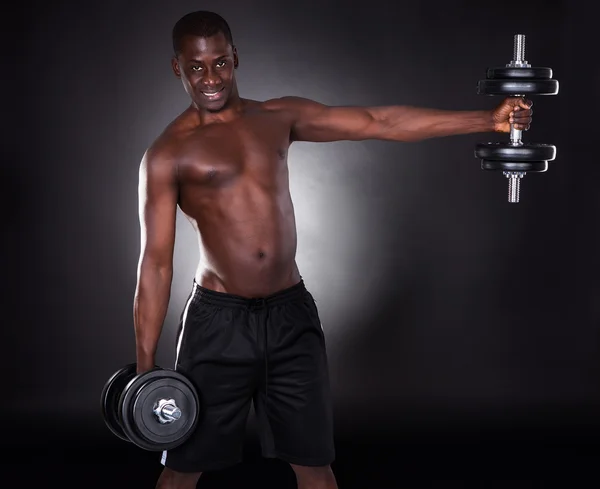 Young African Man Working Out With Dumbbells — Stock Photo, Image
