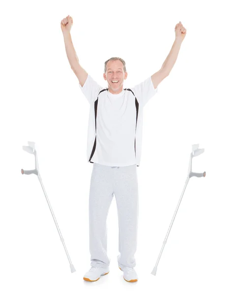 Excited Mature Man Leaving Crutches — Stock Photo, Image