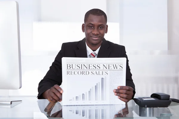 Businessman Showing Newspaper — Stock Photo, Image