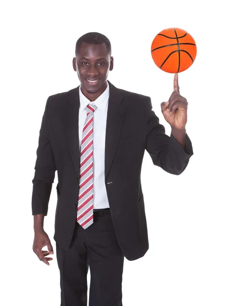 Businessman Spinning Basketball — Stock Photo, Image