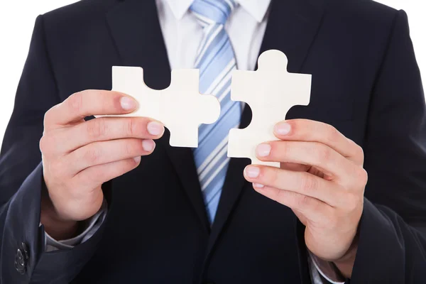 Businessman Solving Jigsaw Puzzle — Stock Photo, Image