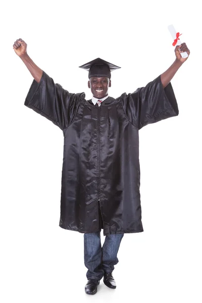 Graduación hombre con brazo levantado — Foto de Stock