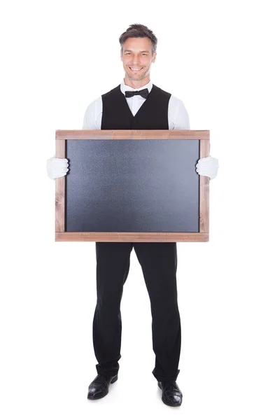 Waiter Holding Chalkboard — Stock Photo, Image