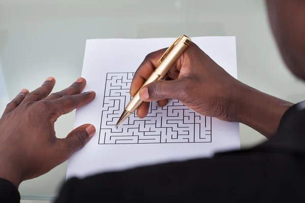 Businessman Solving Maze Puzzle — Stock Photo, Image