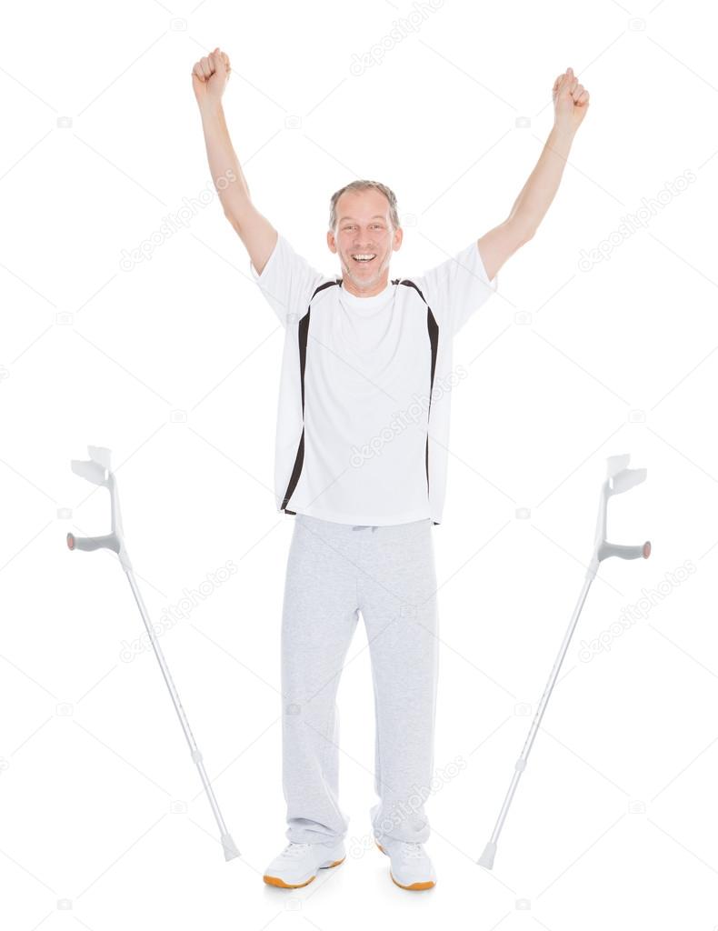Excited Mature Man Leaving Crutches