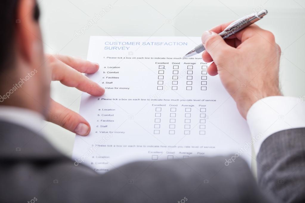 Businessman Filling Customer Survey Form