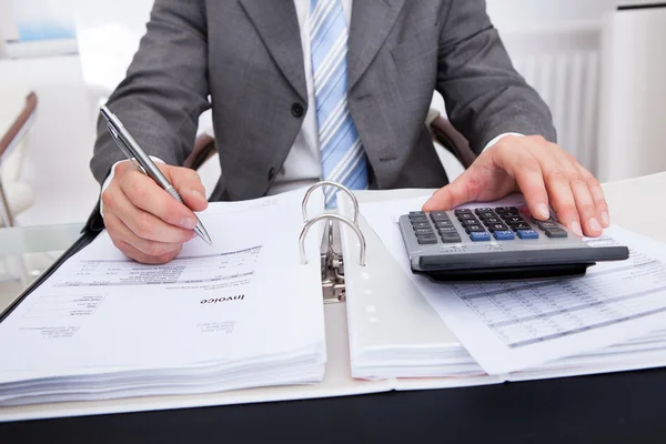 Businessman Calculating Bills — Stock Photo, Image