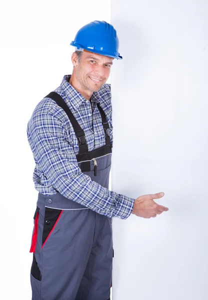 Male Worker Presenting Blank Placard — Stock Photo, Image