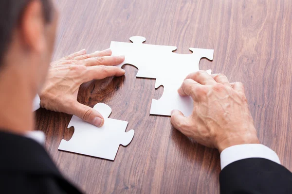 Businessman Solving Jigsaw Puzzle — Stock Photo, Image