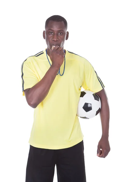 Soccer Referee With Ball And Whistle Stock Photo