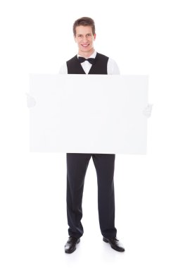 Garson holding billboard