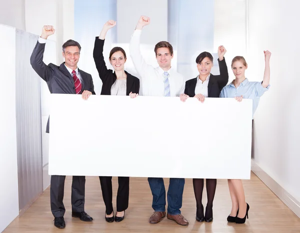 Excited Businessman with Placard — Stock Photo, Image